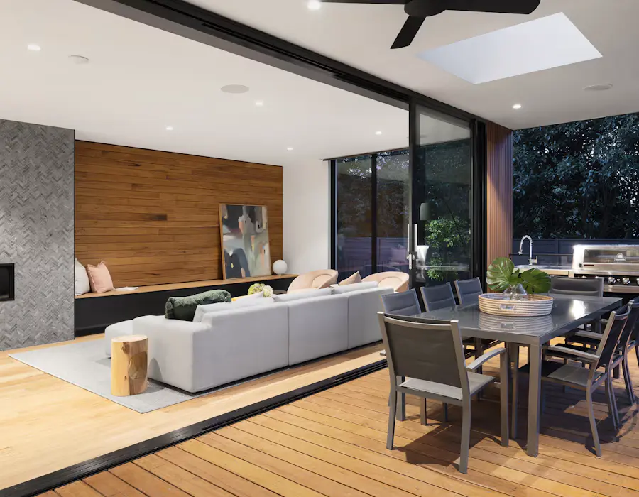 energy-battery-powered-home Modern open-plan living room with sliding glass doors to an outdoor dining patio